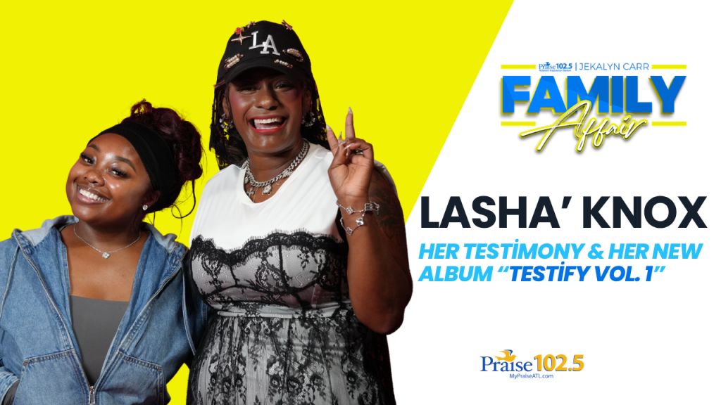 Two smiling women, one wearing a "LA" hat and the other a denim jacket, posing together against a bright yellow background. Text overlay reads "LASHA' KNOX HER TESTIMONY & HER NEW ALBUM 'TESTIFY VOL 1'".