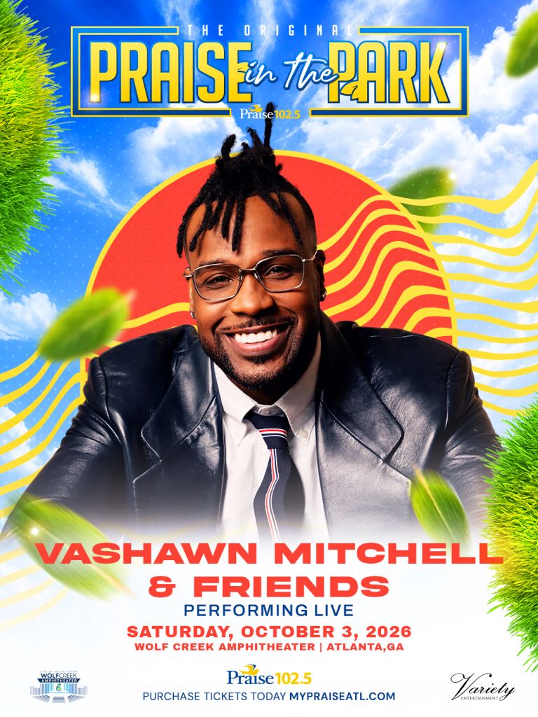 A smiling man with dreadlocks wearing glasses and a suit, standing in front of a colorful background with the text "The Original Praise in the Park" and "Vashawn Mitchell & Friends Performing Live Saturday, October 3, 2026 at Wolf Creek Amphitheater in Atlanta, GA".